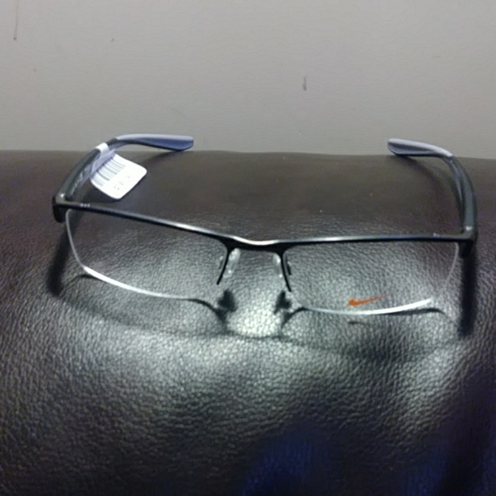 NIKE gun metal frames.